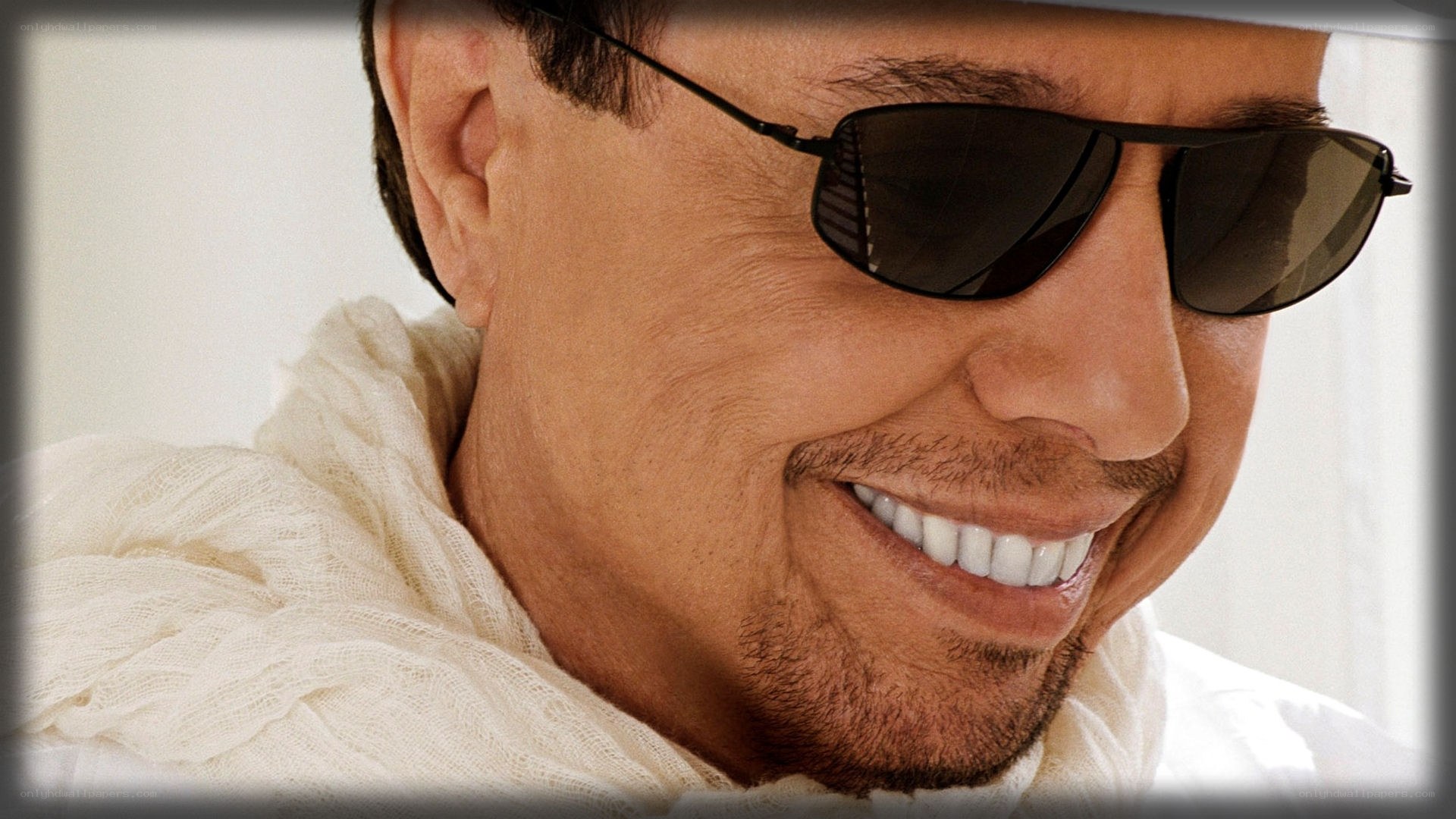 man wearing sunglasses smiling