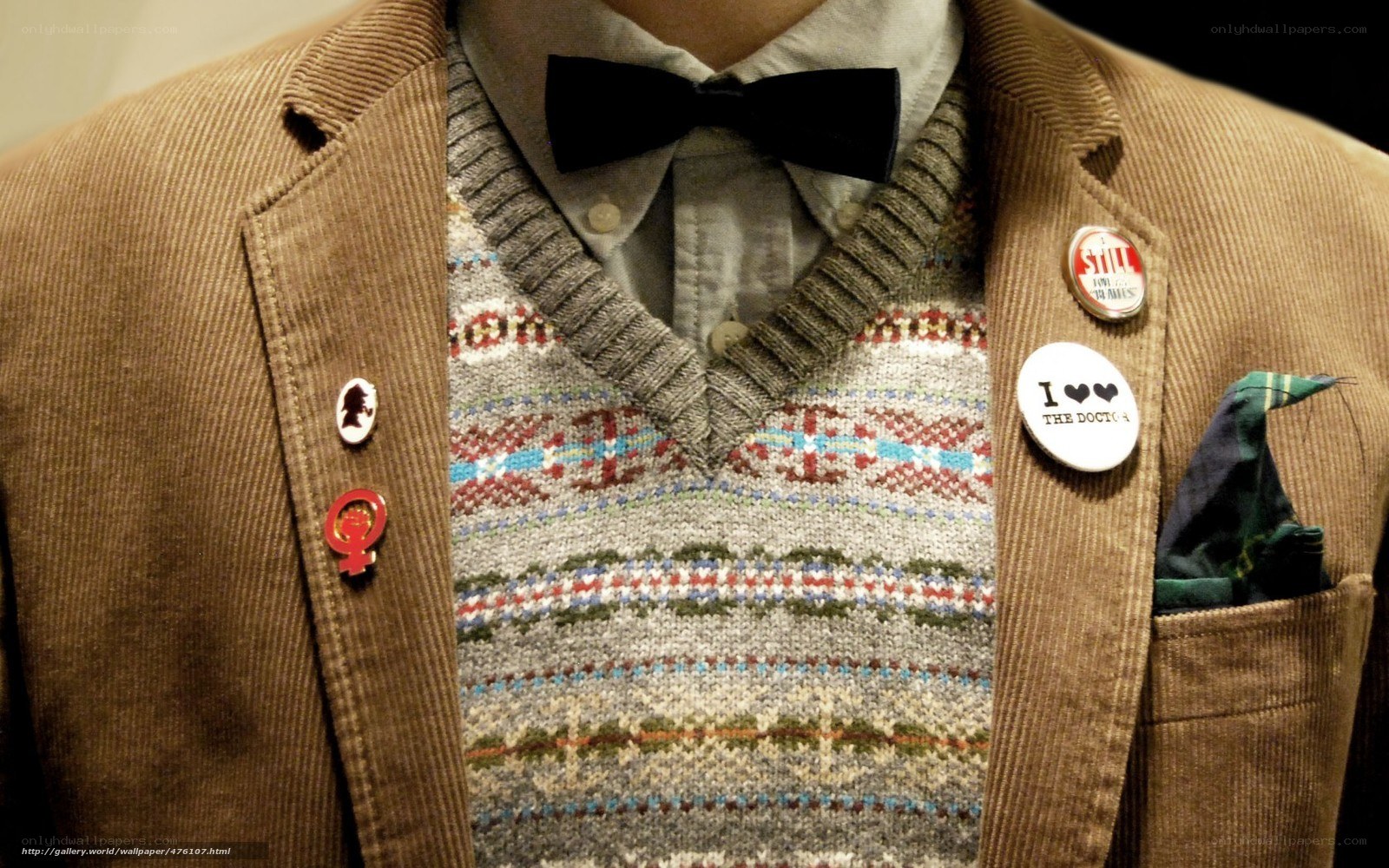 man wearing sweater and bow tie