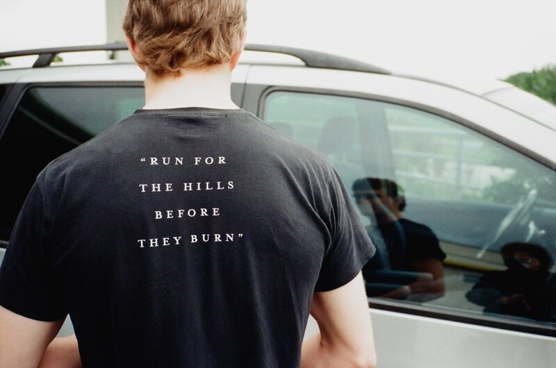 man wearing t-shirt with quote