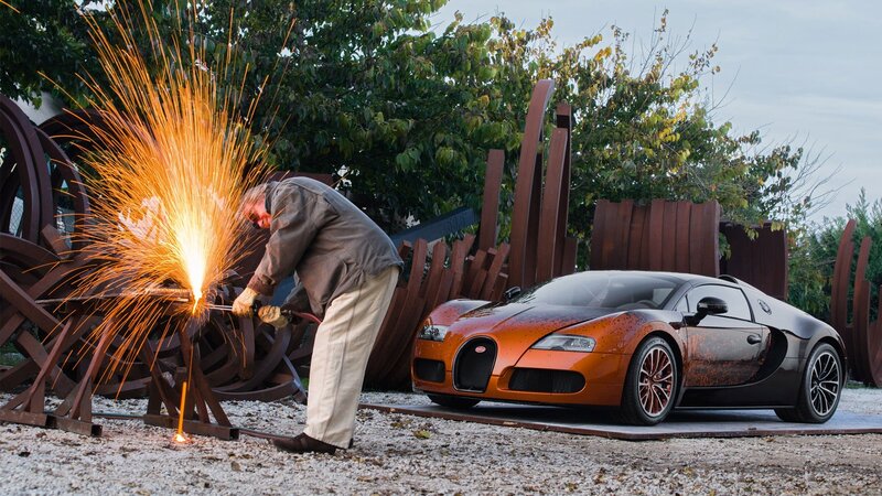 Man Welding Near Car — Orange