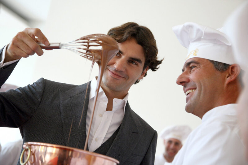 man whisking chocolate with chef
