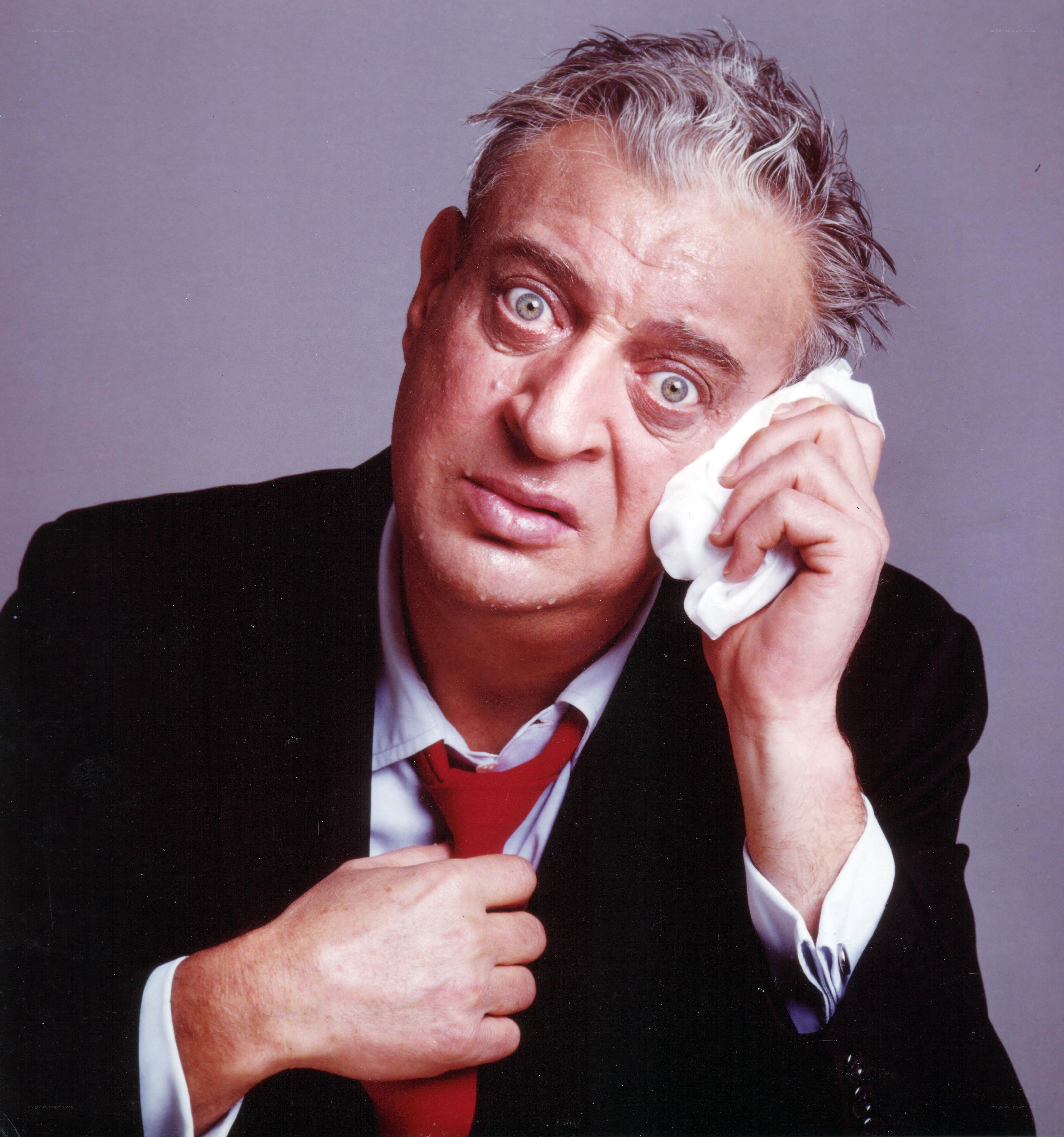 Man wiping face with cloth