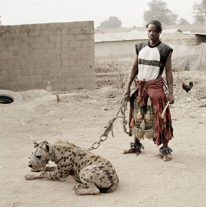 Man with a hyena in Nigeria