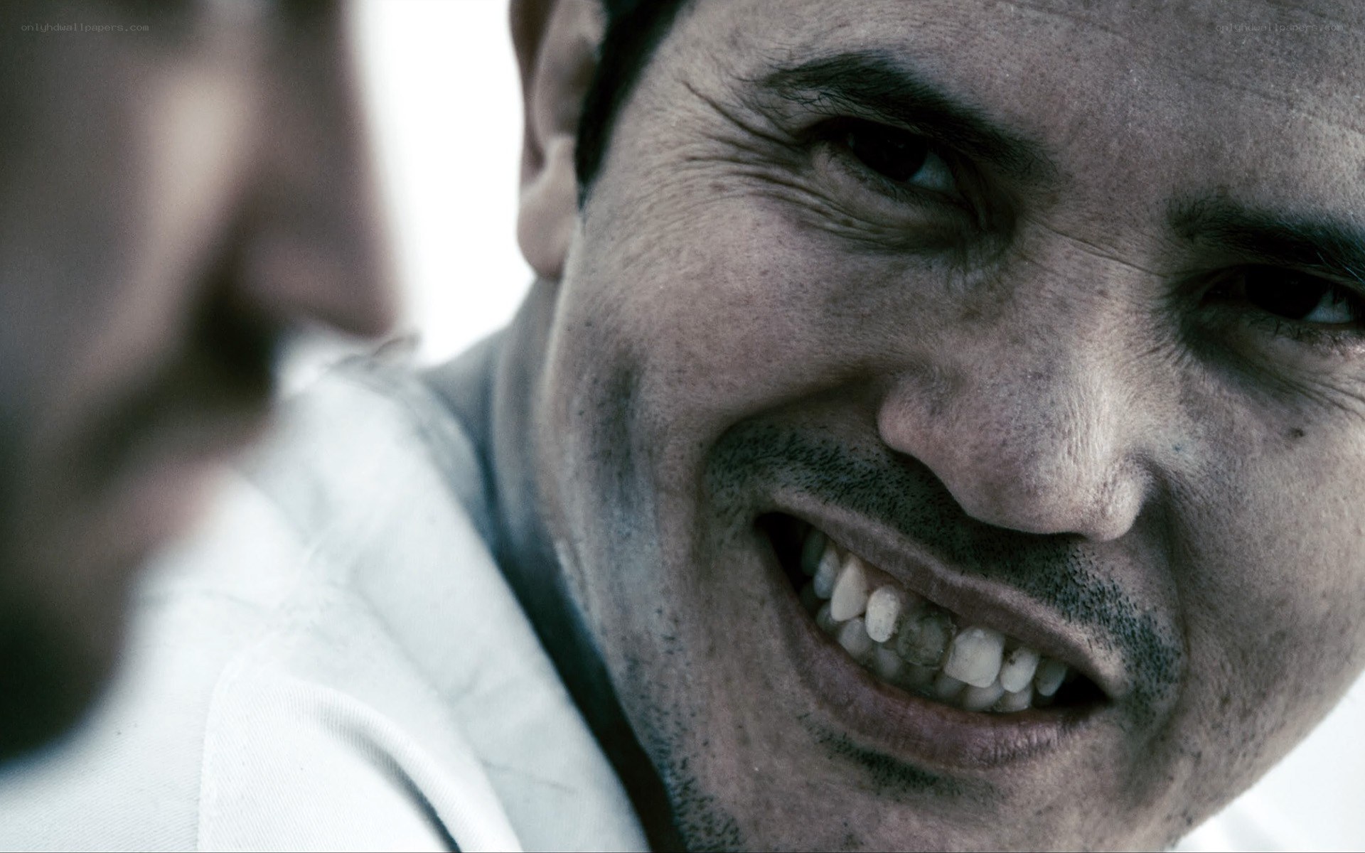 man with a menacing smile