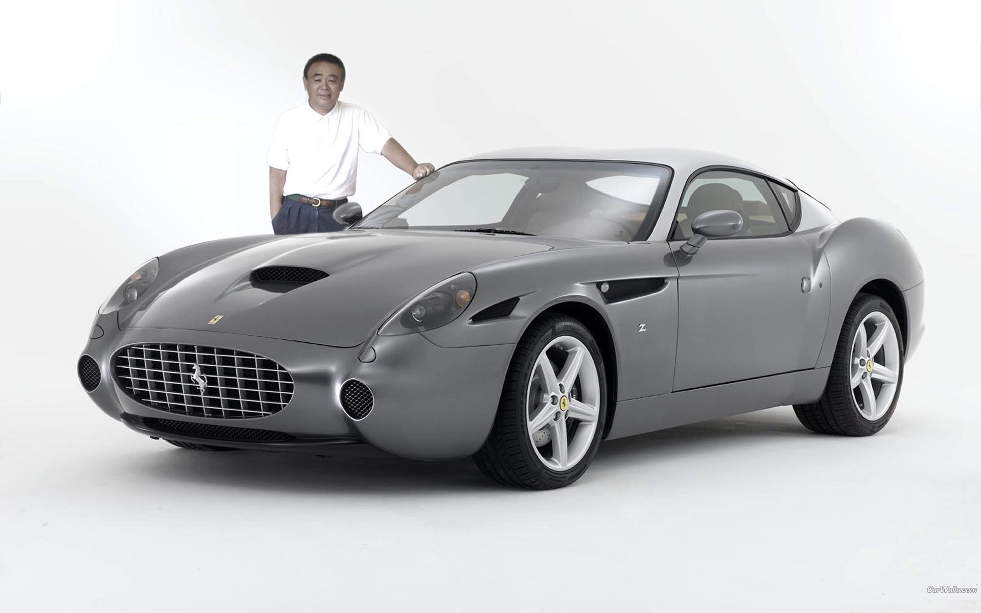 Man with a silver Ferrari