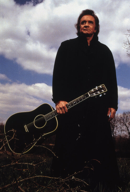 Man with acoustic guitar outdoors