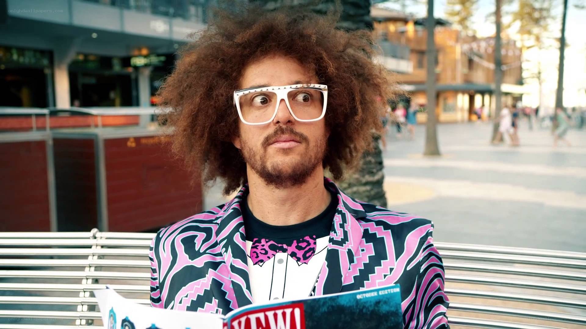 man with afro and glasses