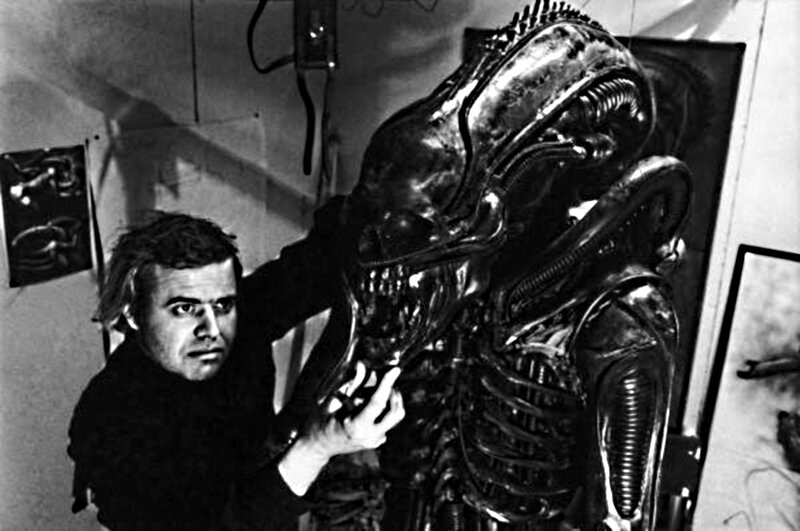 Man with Alien Statue