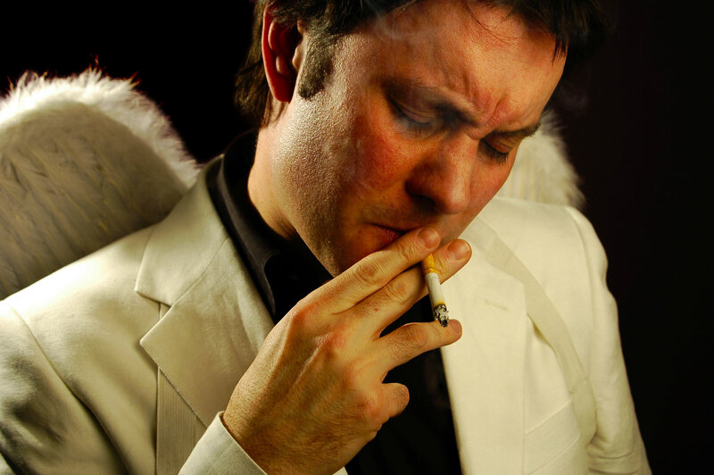 man with angel wings smoking