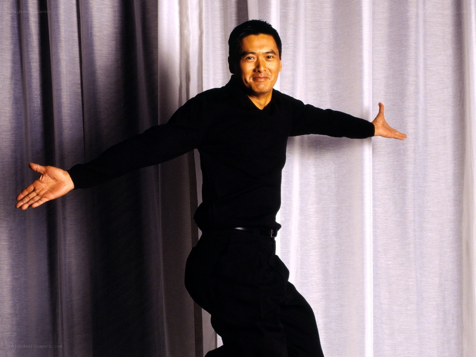 man with arms outstretched