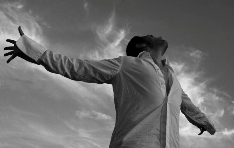 Man with Arms Outstretched — Black, Dramatic, Photograph