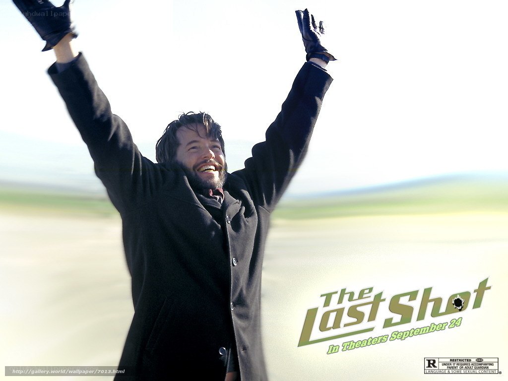 man with arms raised in victory