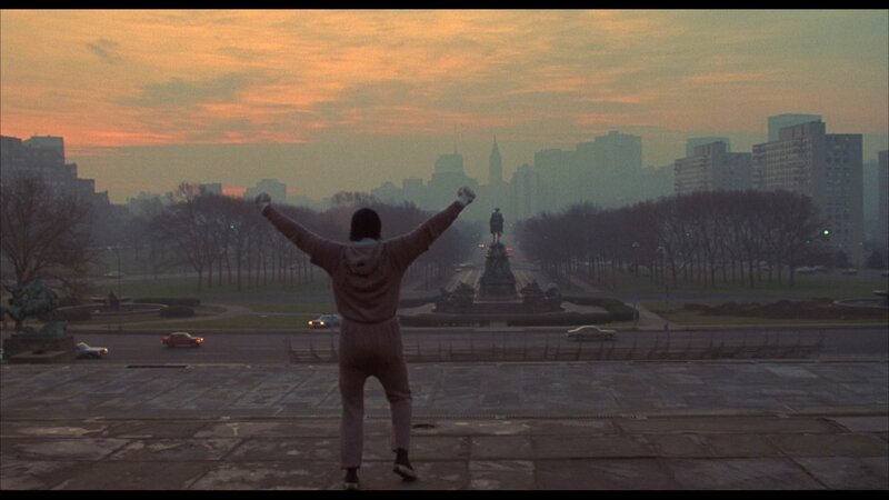 Man with Arms Raised — Orange
