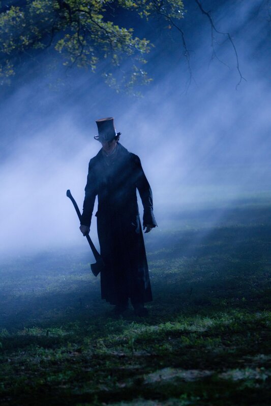 Man with axe in foggy woods