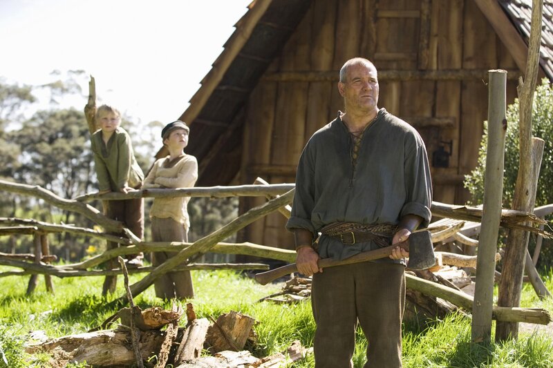 Man with axe in village