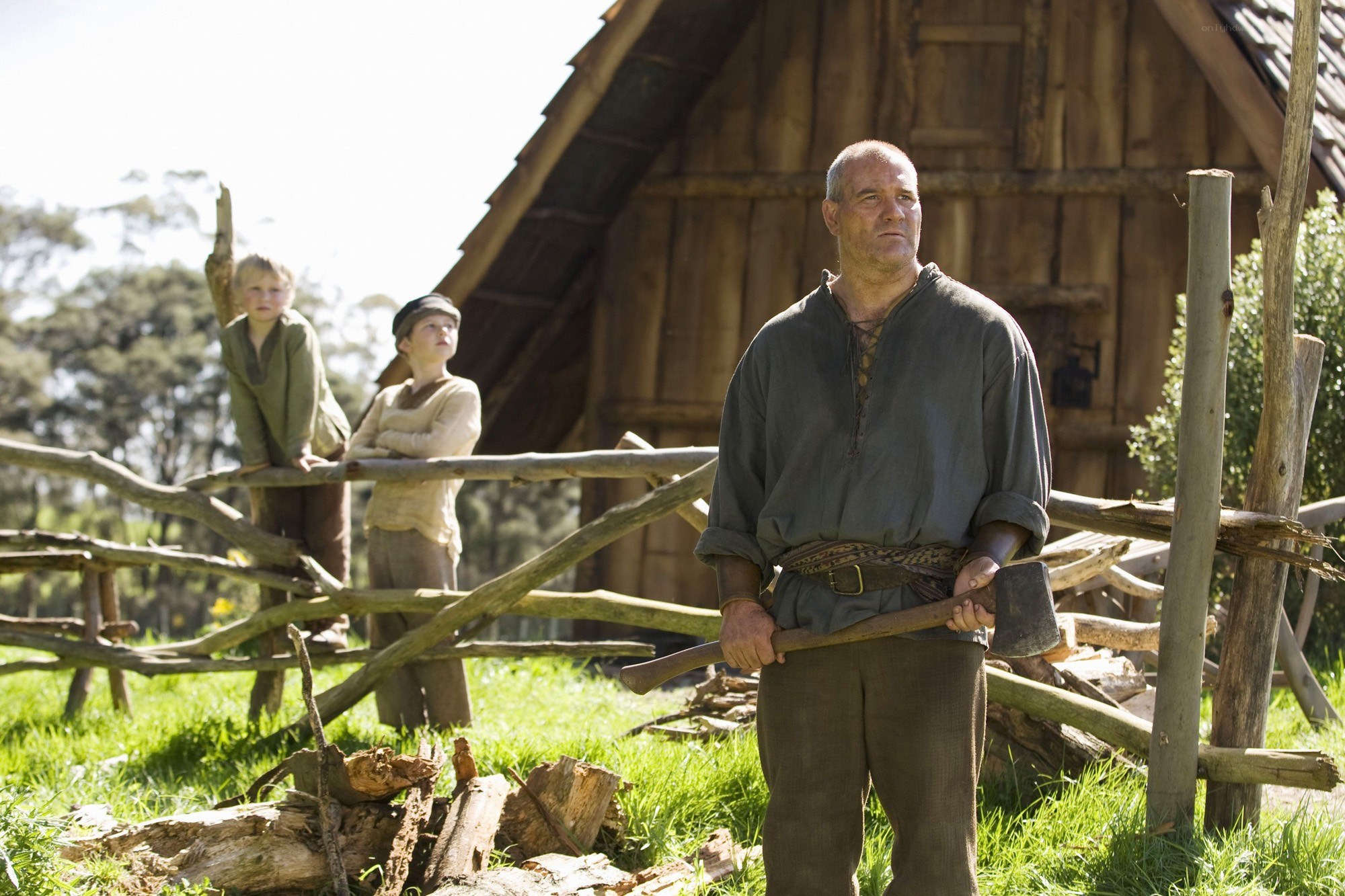 Man with axe in village