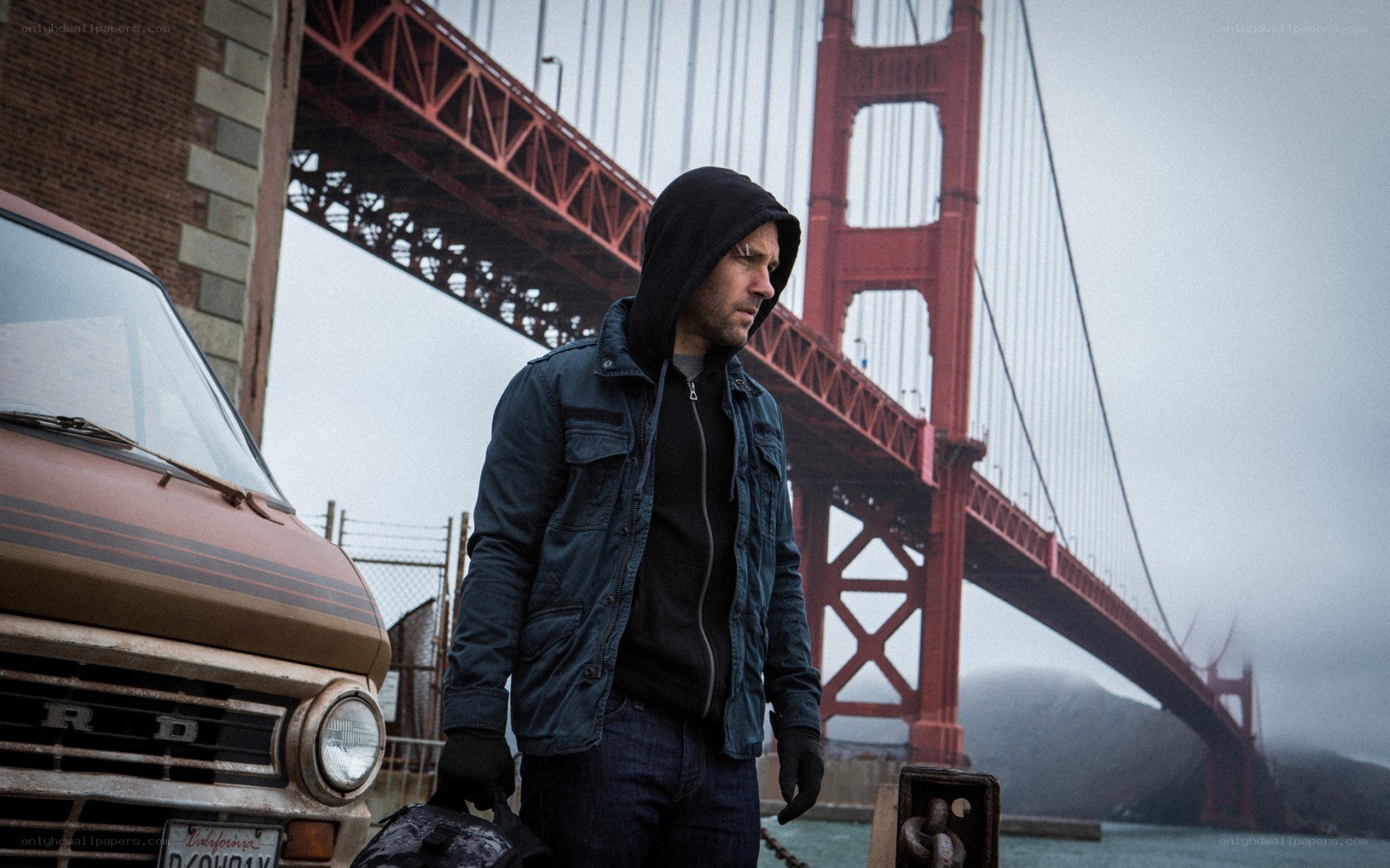 Man with backpack near Golden Gate Bridge
