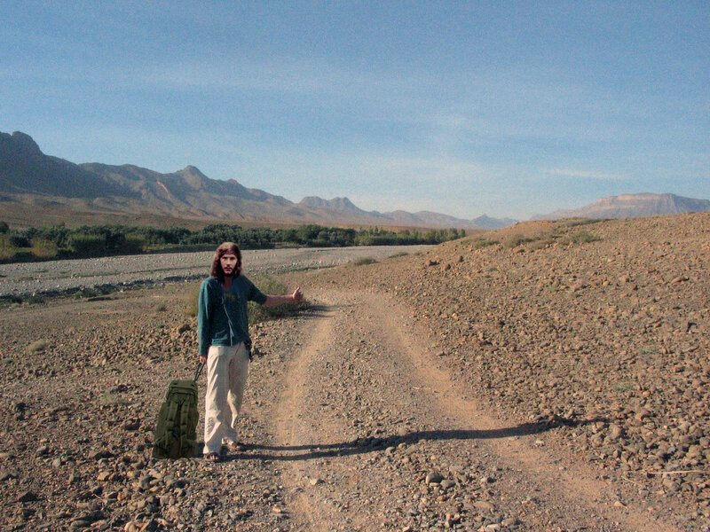 Man with Backpack on Road