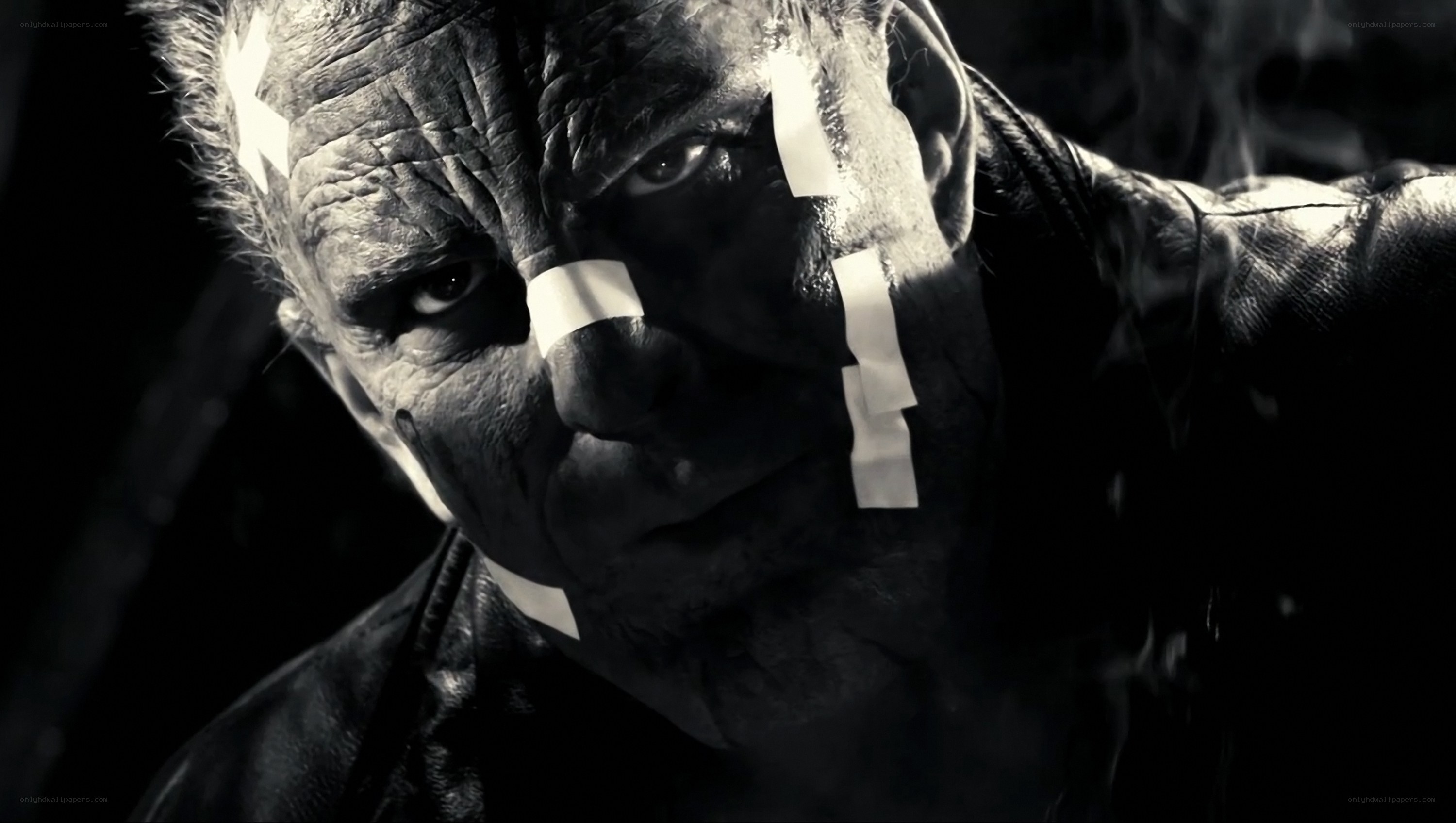 man with bandages on face