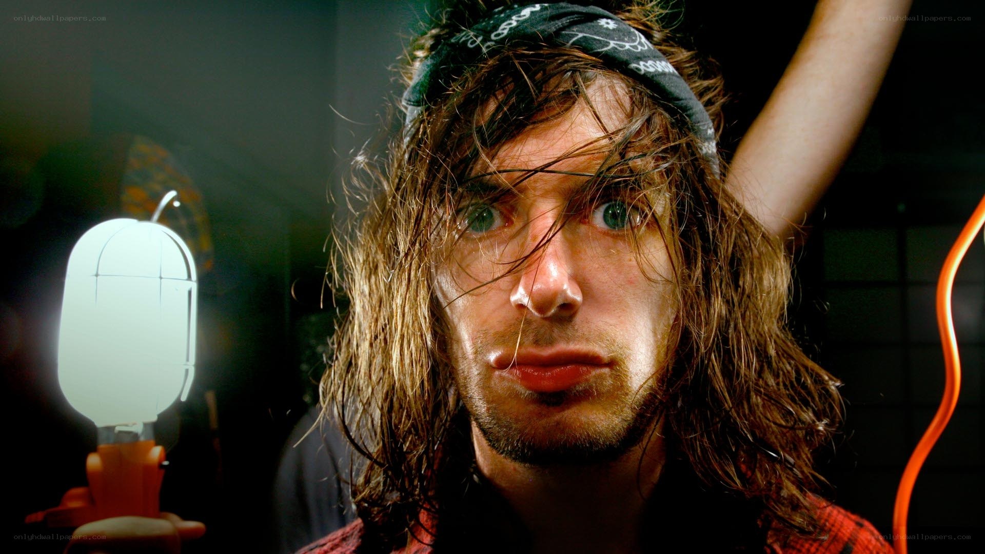 man with bandana and glowing object