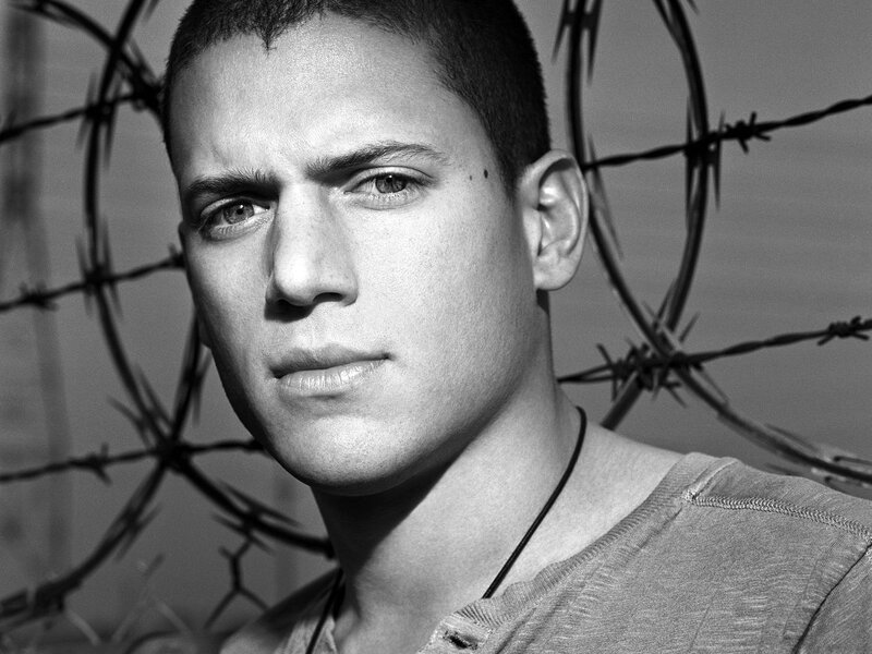 man with barbed wire background