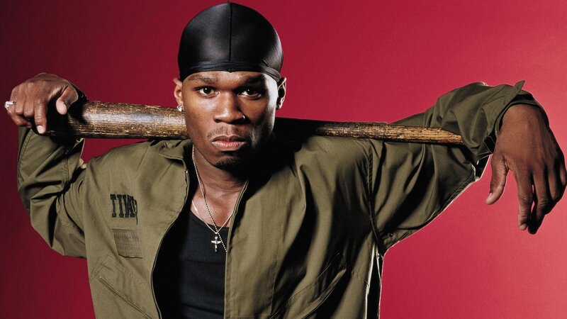 Man with baseball bat on shoulder