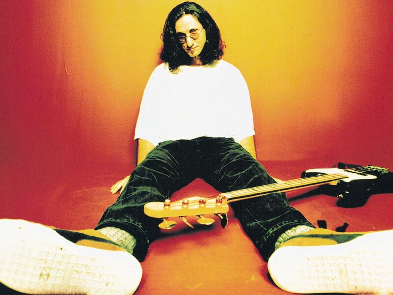 Man with bass guitar on floor