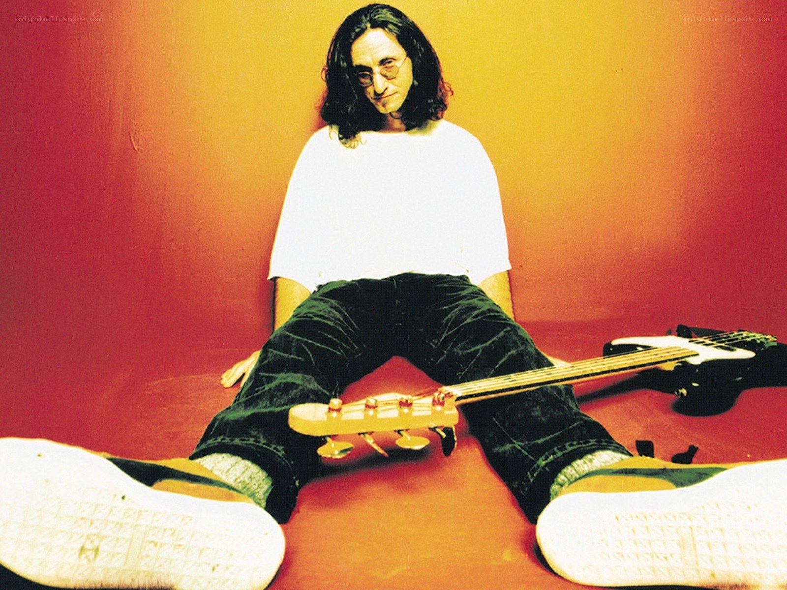 Man with bass guitar on floor