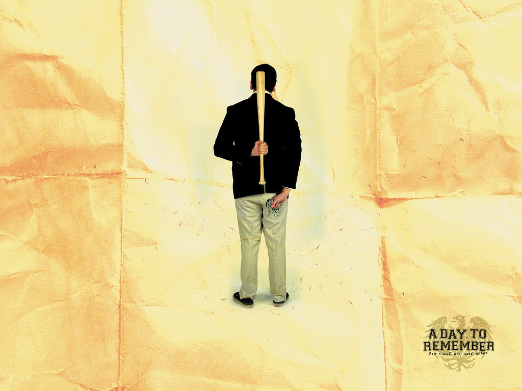 Man with bat on crumpled paper