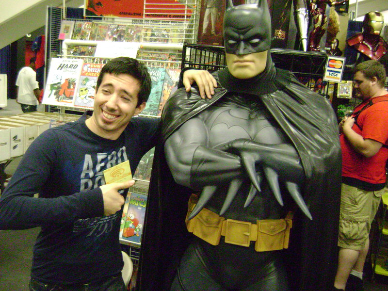 Man with Batman statue