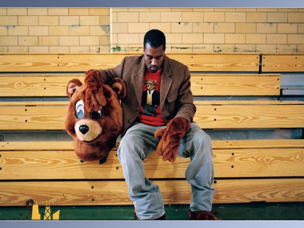 Man with bear mascot on bench
