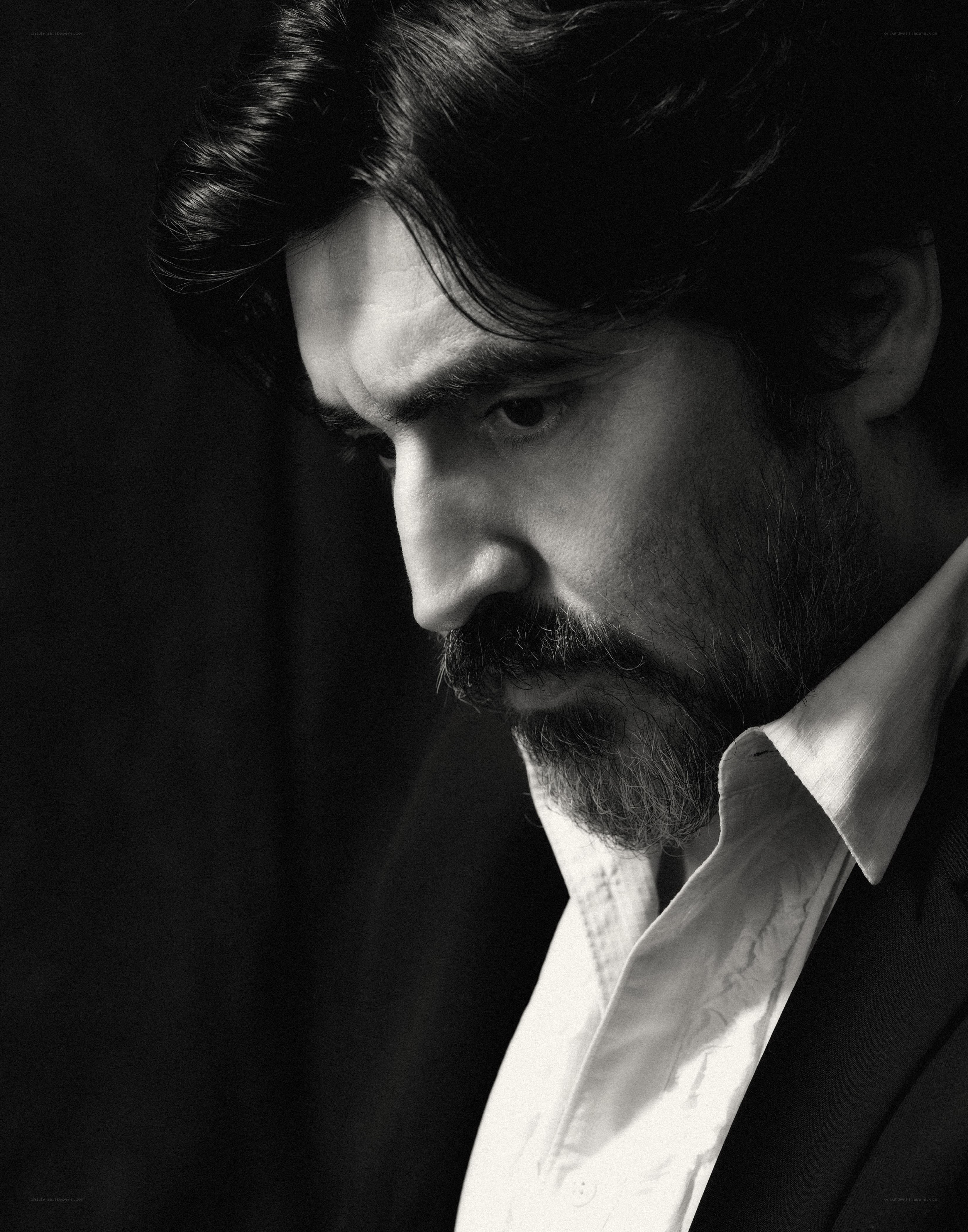 man with beard in black and white