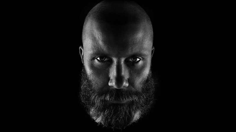 man with beard in black and white