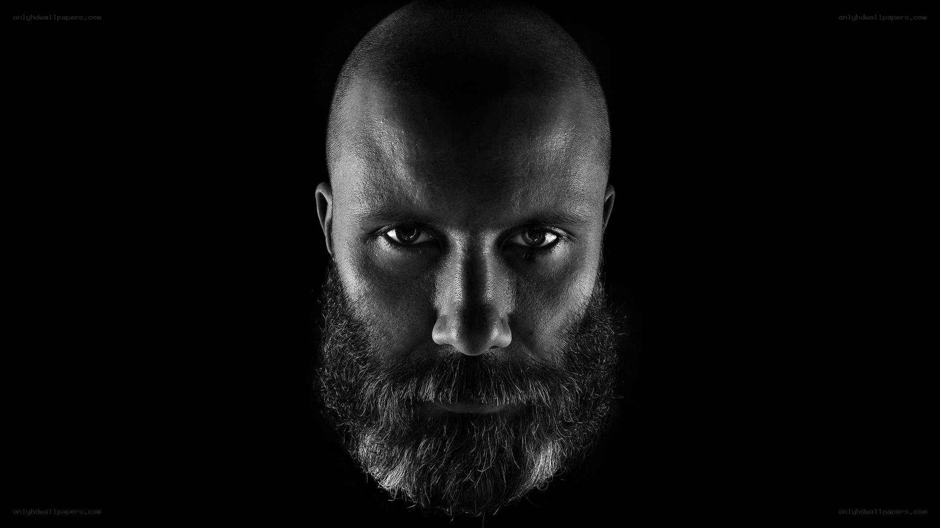 man with beard in black and white