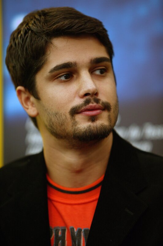 man with beard in black jacket