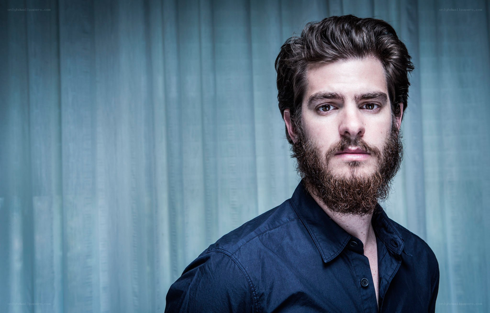 man with beard in blue shirt