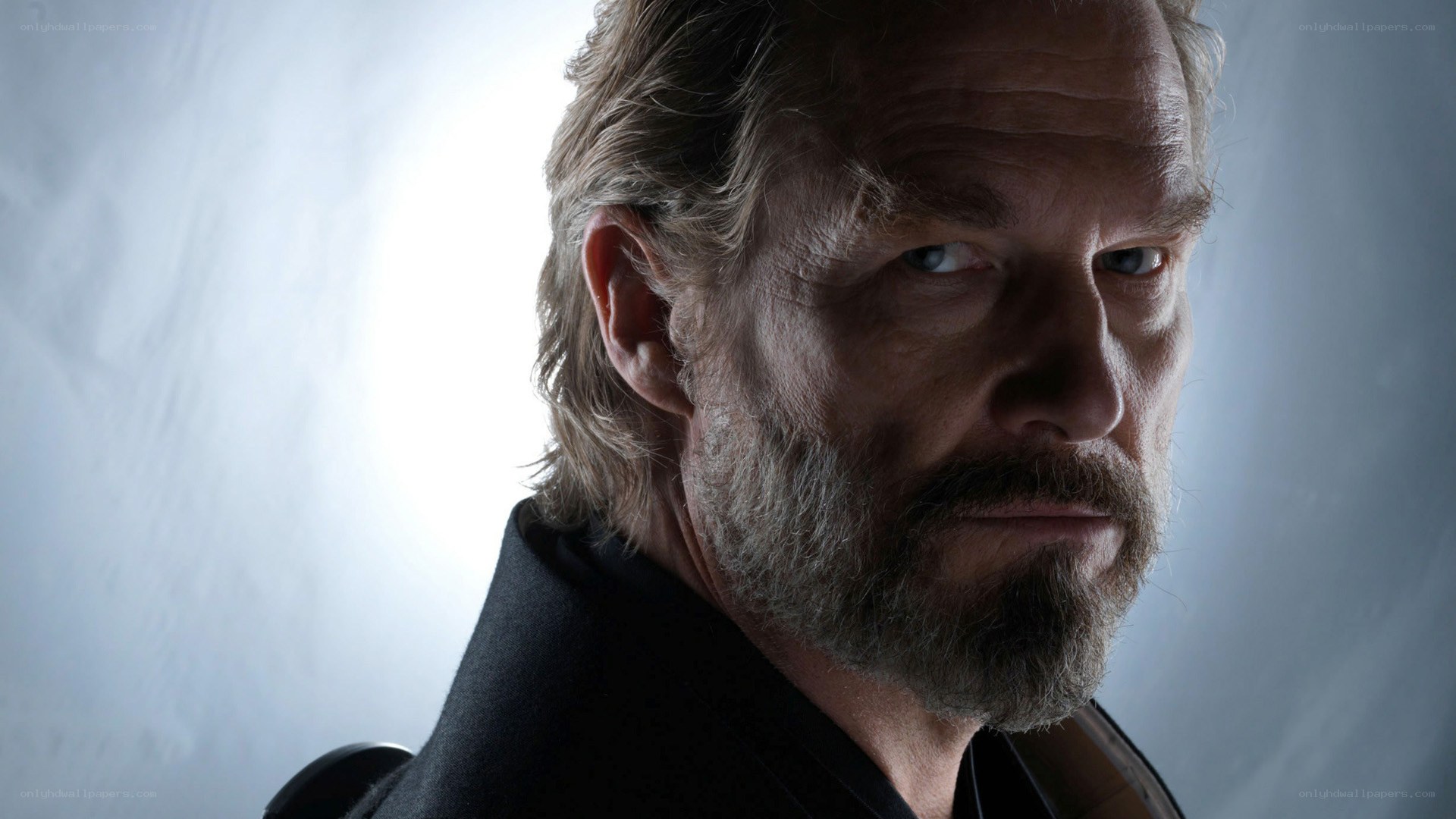 man with beard in dramatic lighting