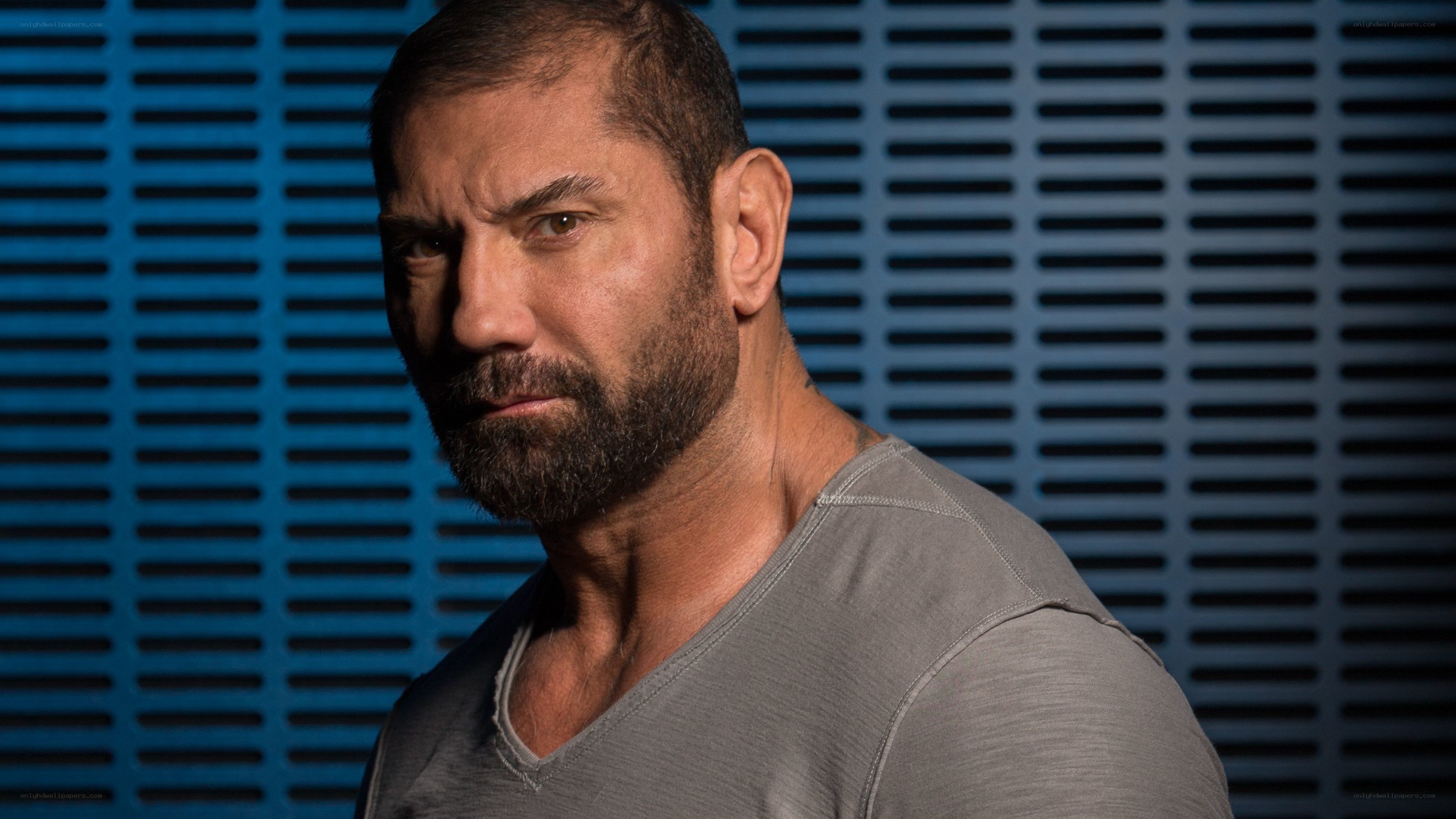 man with beard in gray shirt