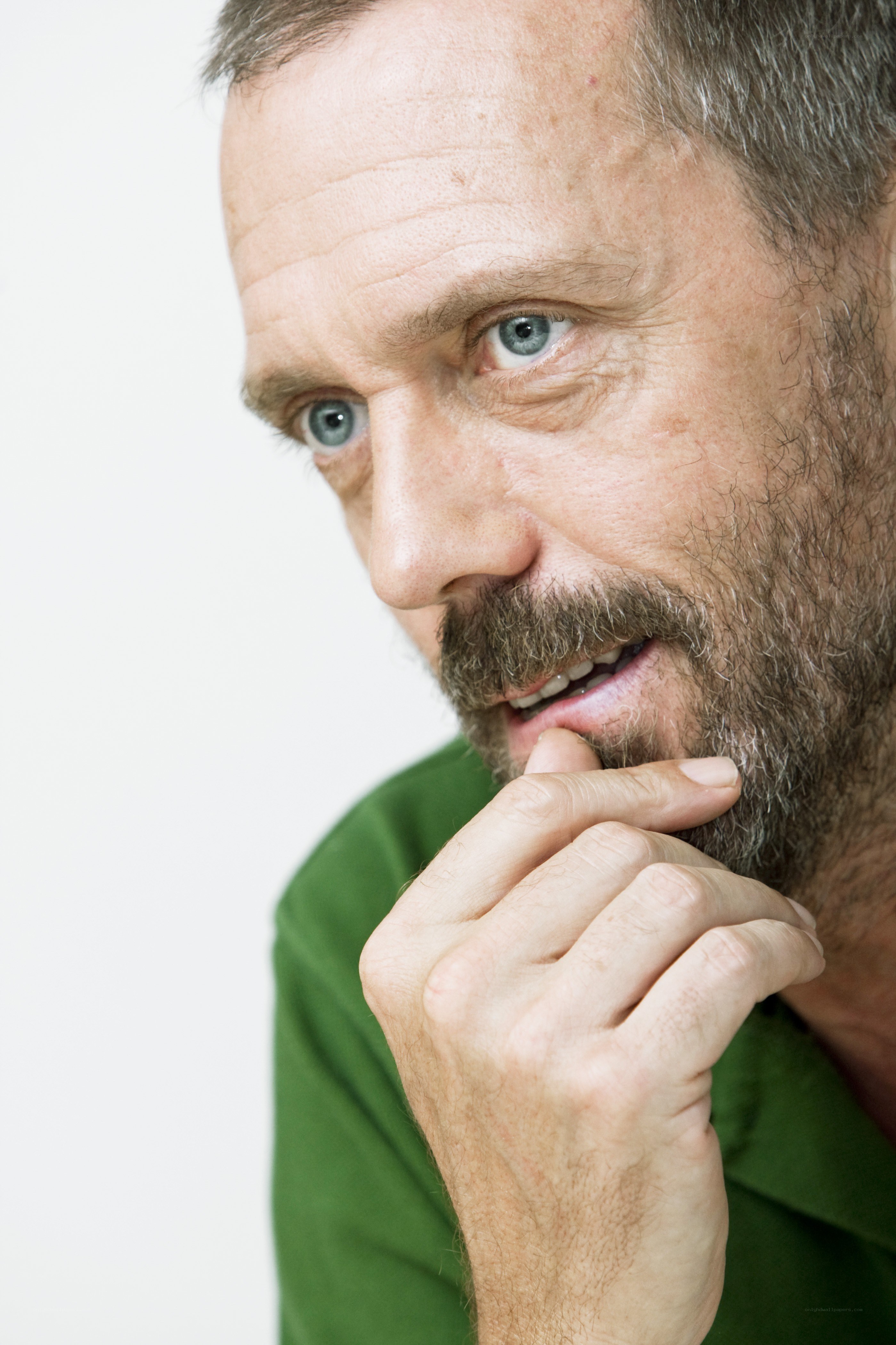 man with beard in green shirt