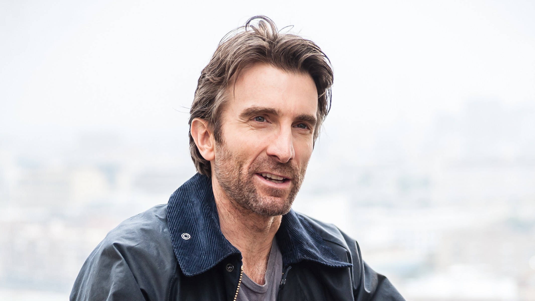 man with beard in jacket