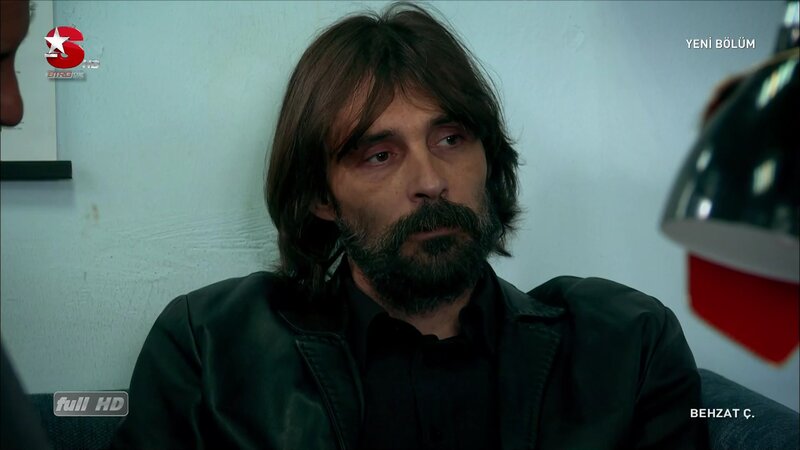 man with beard in leather jacket