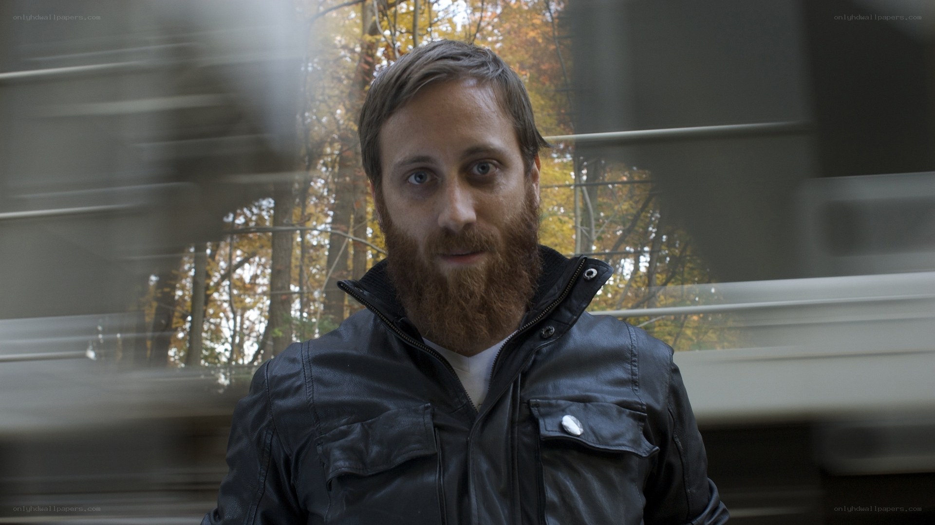 man with beard in leather jacket