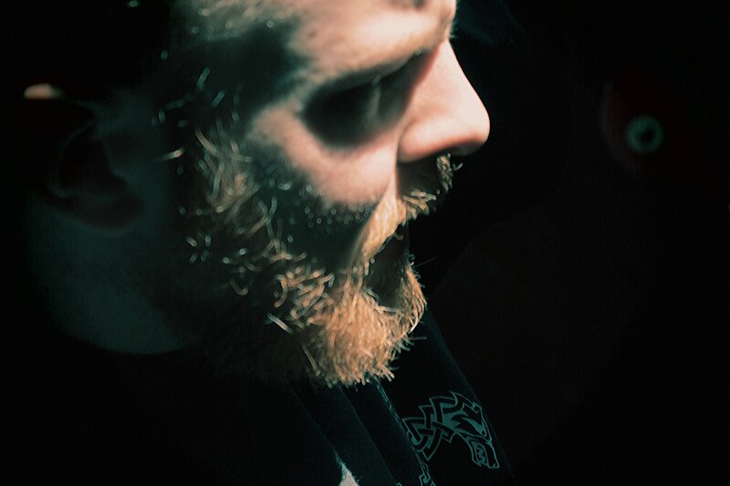 man with beard in profile