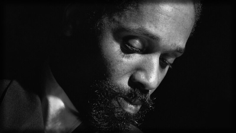 man with beard in shadow