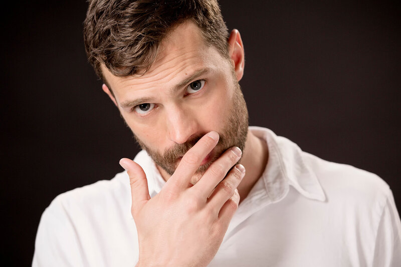 Man with Beard in White Shirt — Serious