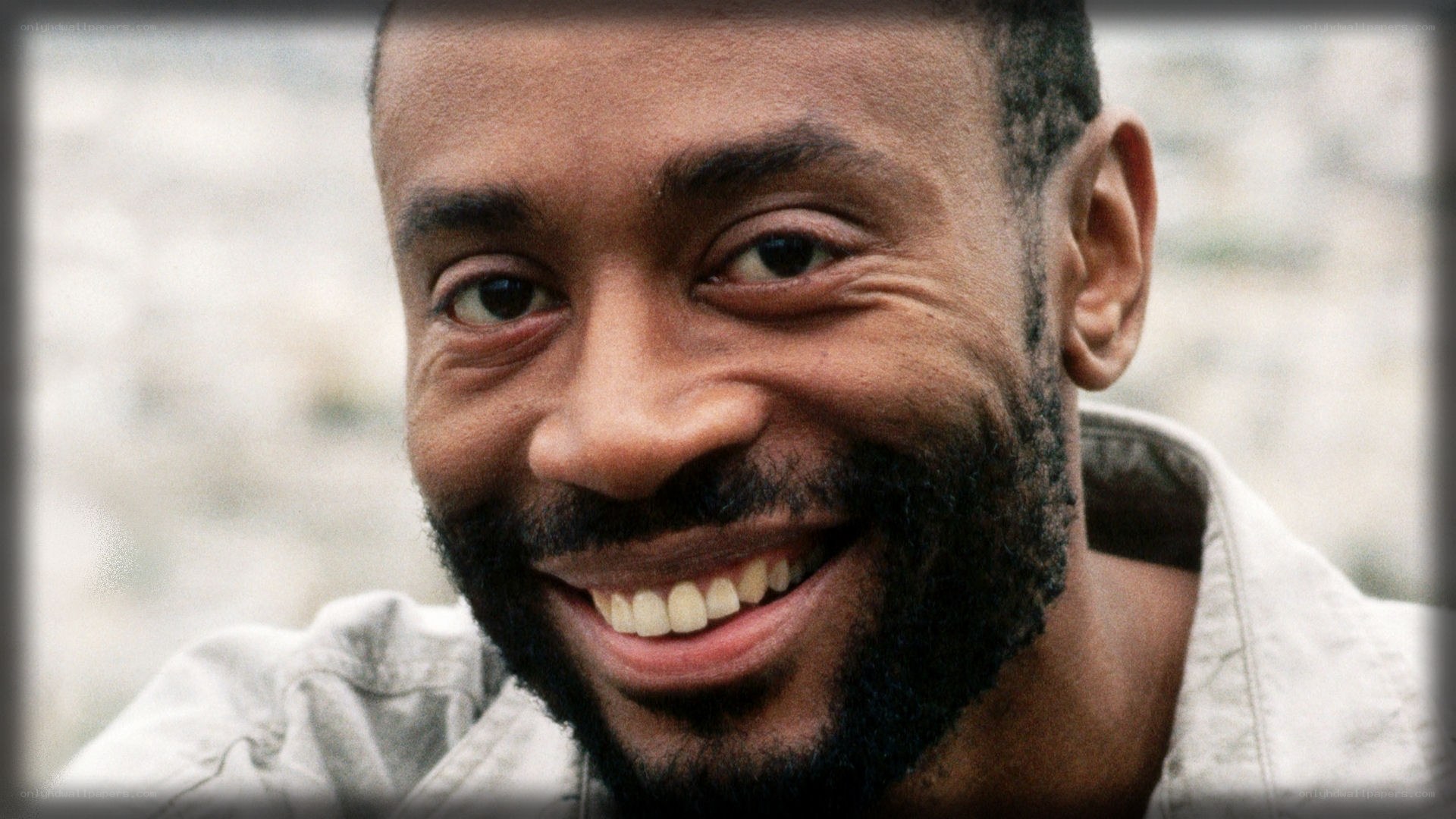 man with beard smiling