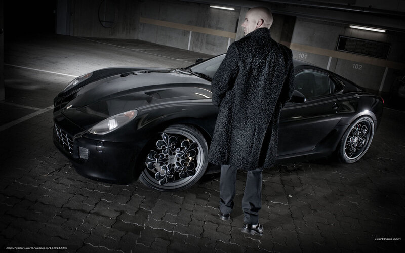 man with black car in garage