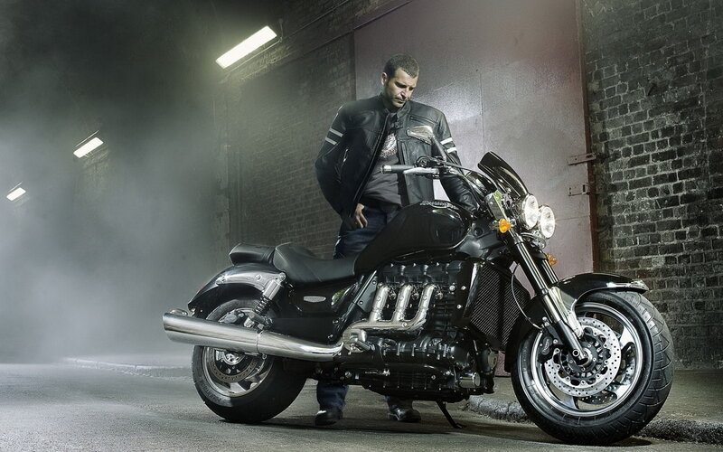 Man with Black Motorcycle
