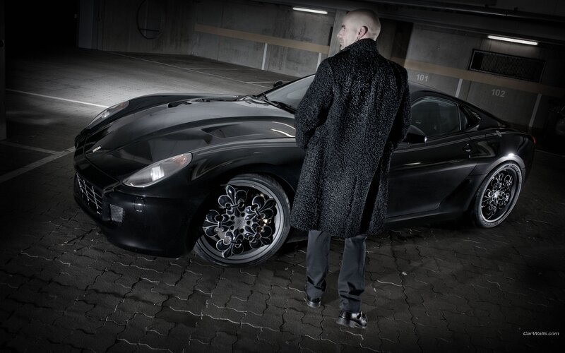 Man with black sports car