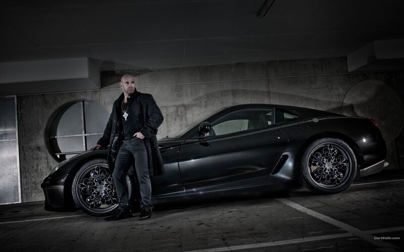 man with black sports car